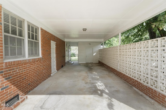 view of patio / terrace featuring an attached carport