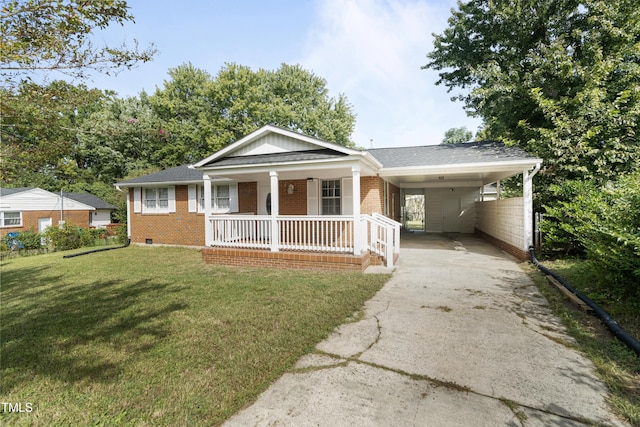 view of front facade featuring an attached carport, covered porch, brick siding, driveway, and a front yard