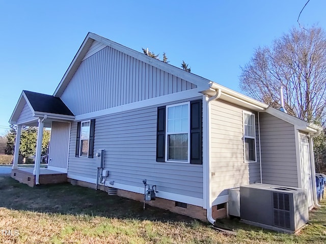 view of home's exterior featuring central AC unit, crawl space, and a lawn