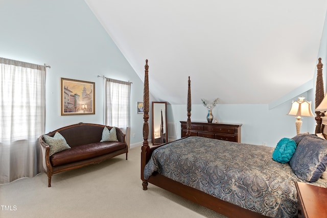 carpeted bedroom featuring vaulted ceiling