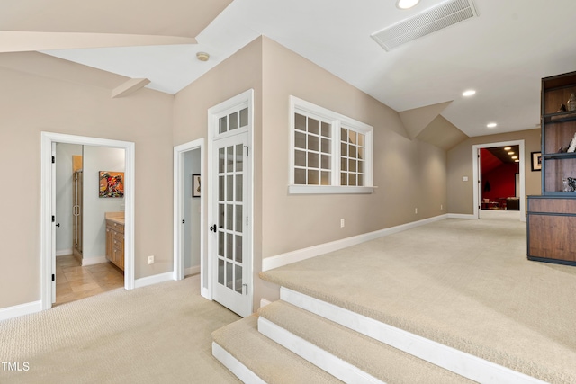 interior space with carpet floors, french doors, recessed lighting, visible vents, and baseboards