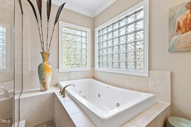 bathroom with a whirlpool tub, ornamental molding, and tiled shower