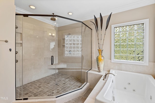 bathroom with a jetted tub, a stall shower, and ornamental molding