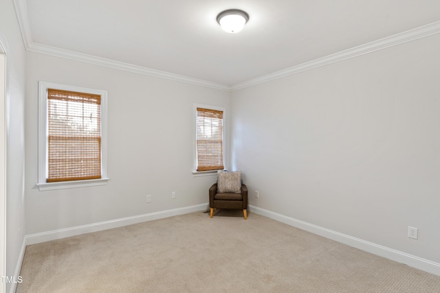 carpeted empty room with ornamental molding, plenty of natural light, and baseboards