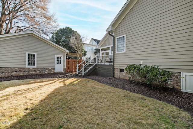 view of yard with stairway and fence