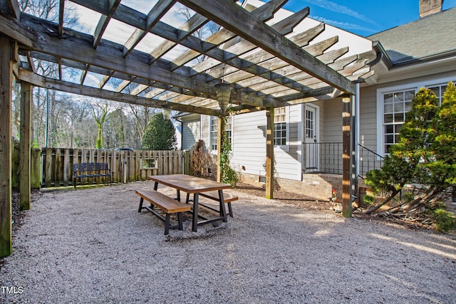 view of patio / terrace with fence, a pergola, and outdoor dining space