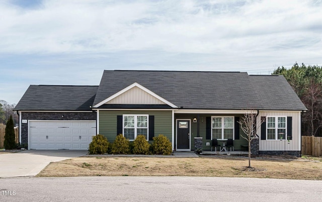 ranch-style house with covered porch, a garage, fence, concrete driveway, and board and batten siding