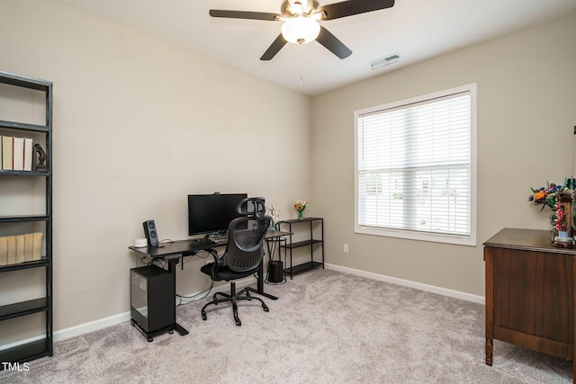 home office featuring a ceiling fan, carpet flooring, visible vents, and baseboards