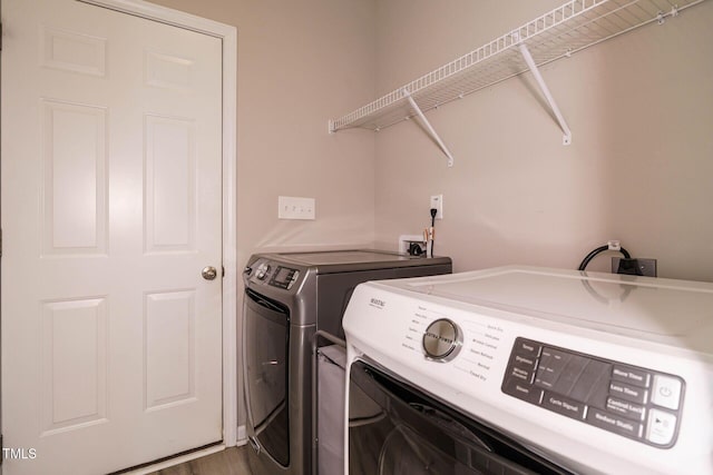 laundry area featuring laundry area and washer and clothes dryer