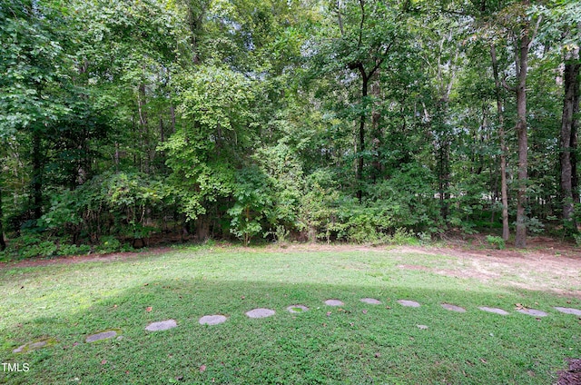 view of yard with a wooded view