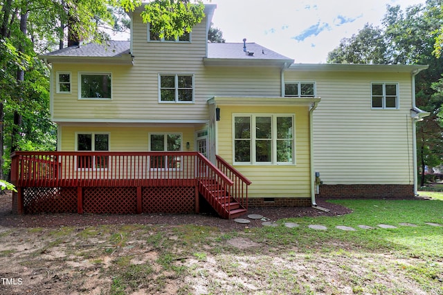 rear view of house featuring crawl space, roof with shingles, a yard, and a wooden deck