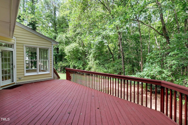 deck featuring a wooded view