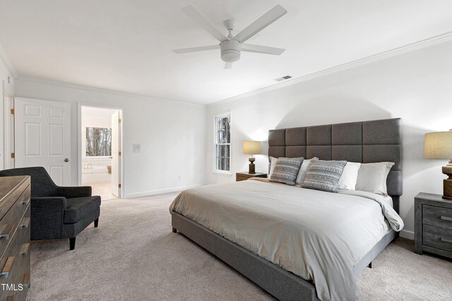 bedroom with light carpet, visible vents, baseboards, ensuite bath, and crown molding