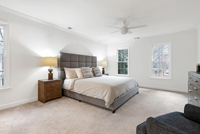 bedroom featuring crown molding, visible vents, light carpet, ceiling fan, and baseboards