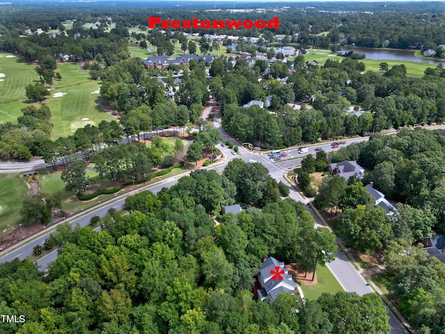 bird's eye view with view of golf course and a water view