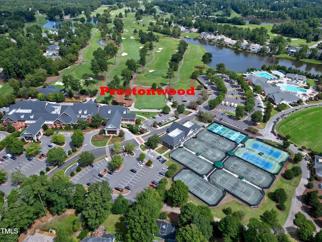 bird's eye view with view of golf course and a water view