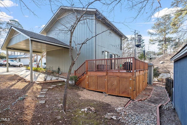 back of house featuring a wooden deck