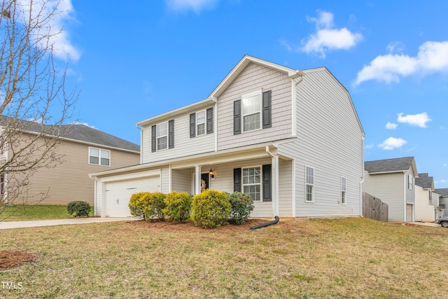 traditional home with a front yard and concrete driveway