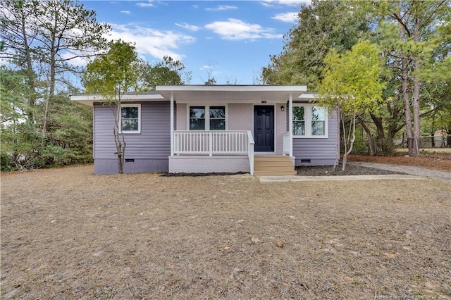 view of front of house with covered porch and crawl space