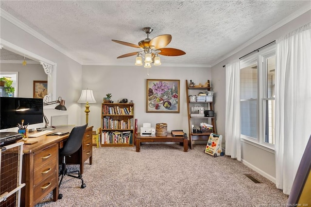 carpeted office space with ornamental molding, visible vents, ceiling fan, and a textured ceiling