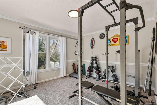 exercise room with baseboards, ornamental molding, and a textured ceiling