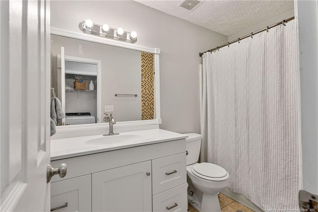 full bath featuring visible vents, toilet, tile patterned flooring, a textured ceiling, and vanity