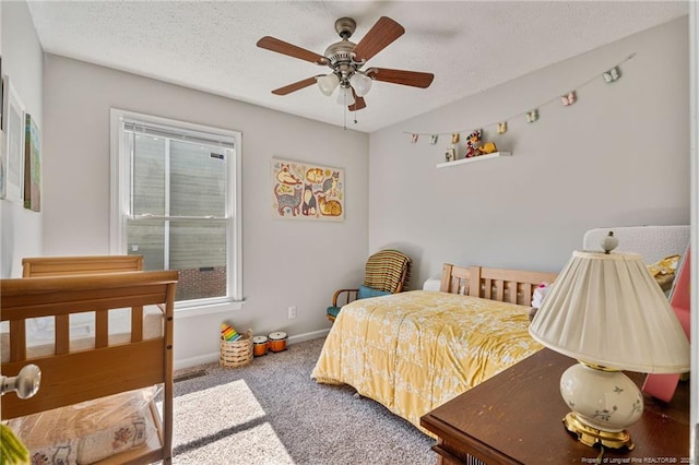 bedroom featuring a textured ceiling, ceiling fan, carpet flooring, and baseboards