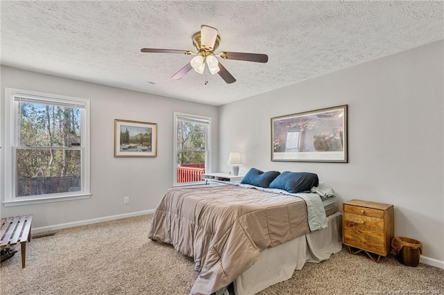 bedroom with a textured ceiling, carpet floors, a ceiling fan, baseboards, and access to outside