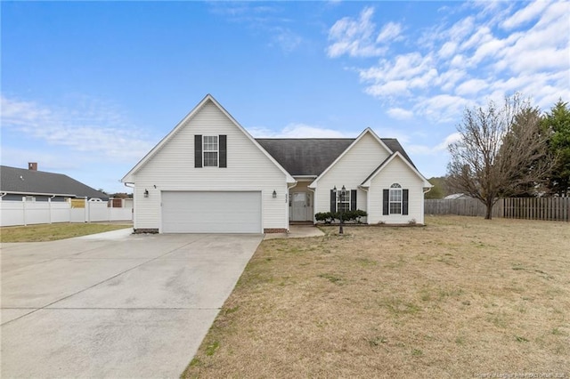 view of front facade with driveway, a front lawn, and fence