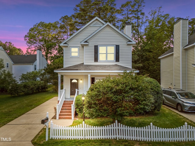 131 Cricketgrass Dr, Cary, NC 27513 - traditional-style home with covered porch, a chimney, and stairs