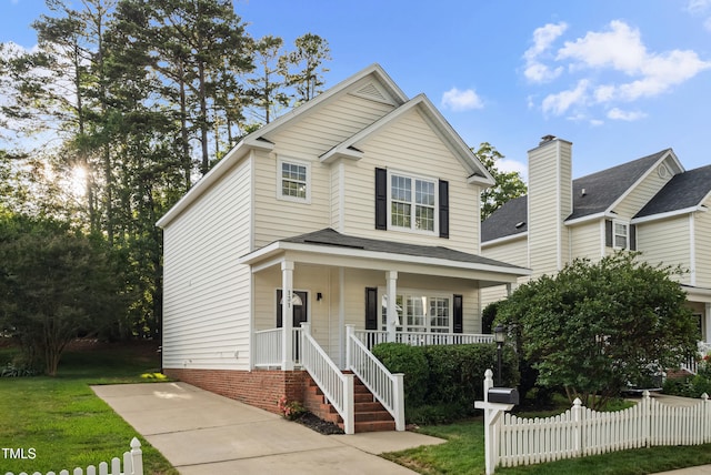 131 Cricketgrass Dr, Cary, NC 27513 - traditional-style house with a porch and roof with shingles