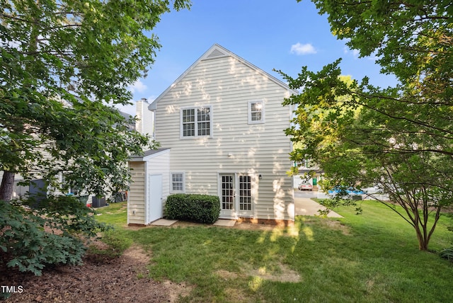 131 Cricketgrass Dr, Cary, NC 27513 - rear view of house with a yard, french doors, and a chimney
