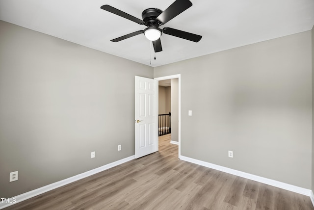 131 Cricketgrass Dr, Cary, NC 27513 - spare room featuring light wood-type flooring, baseboards, and a ceiling fan