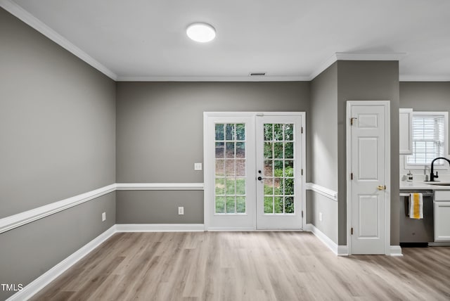 131 Cricketgrass Dr, Cary, NC 27513 - entryway featuring light wood finished floors, a sink, french doors, crown molding, and baseboards