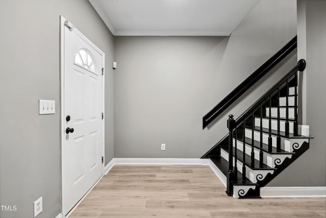 131 Cricketgrass Dr, Cary, NC 27513 - entrance foyer featuring wood finished floors, stairs, and baseboards