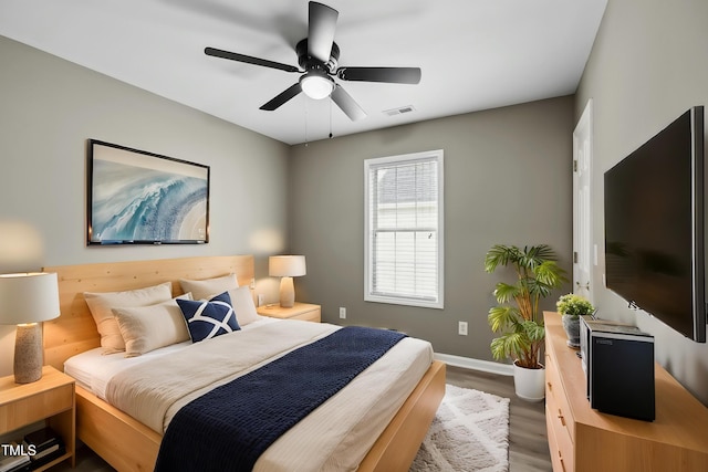 131 Cricketgrass Dr, Cary, NC 27513 - bedroom featuring wood finished floors, baseboards, and a ceiling fan