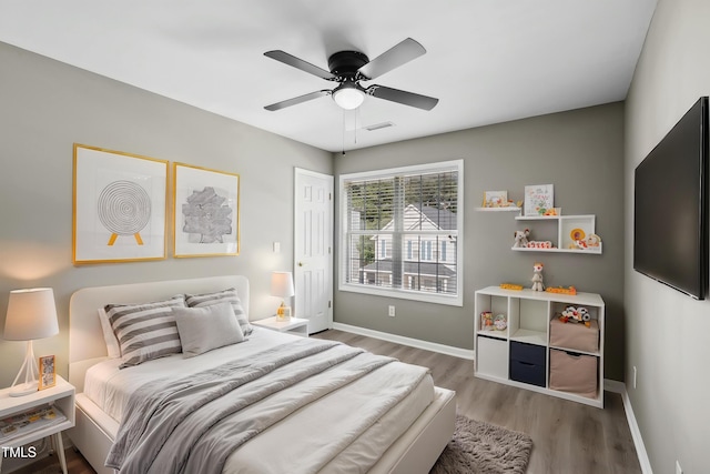 131 Cricketgrass Dr, Cary, NC 27513 - bedroom featuring wood finished floors, baseboards, and a ceiling fan