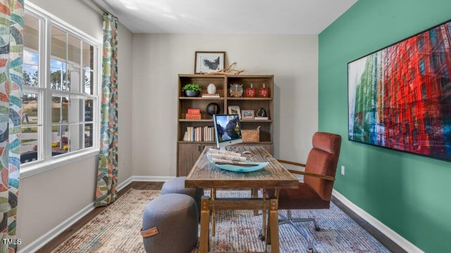 dining room with wood finished floors and baseboards