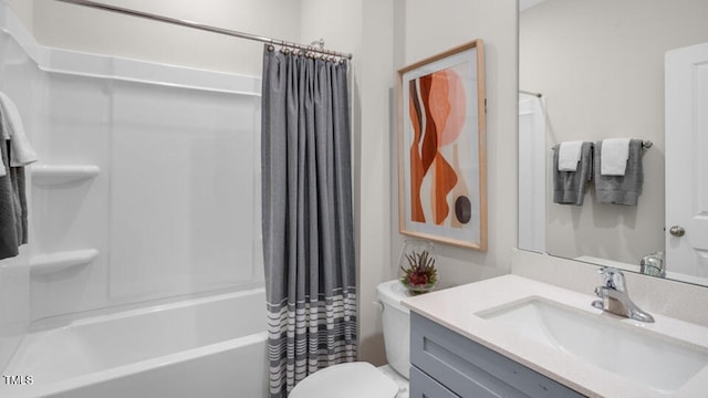 bathroom with shower / bathtub combination with curtain, toilet, and vanity