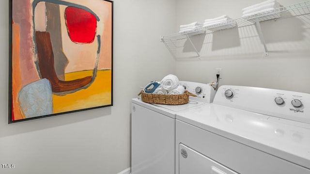 laundry room featuring laundry area and washing machine and clothes dryer