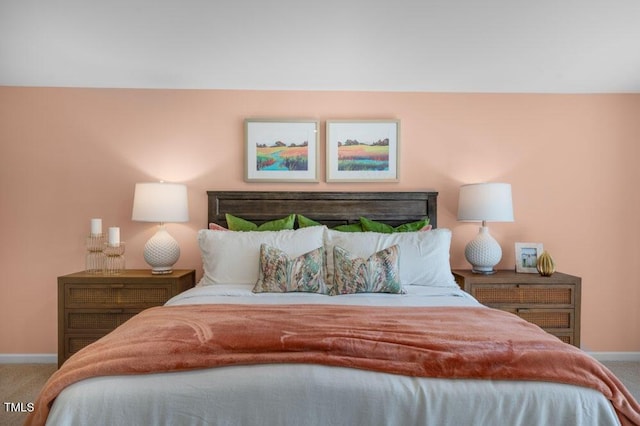 bedroom featuring carpet floors and baseboards