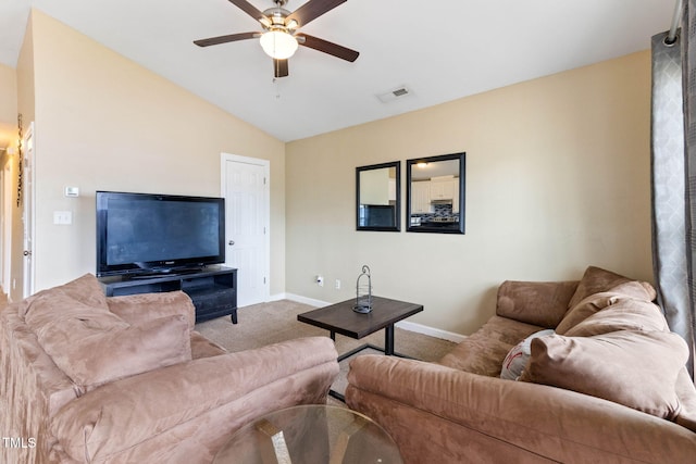 carpeted living area featuring vaulted ceiling, baseboards, visible vents, and a ceiling fan