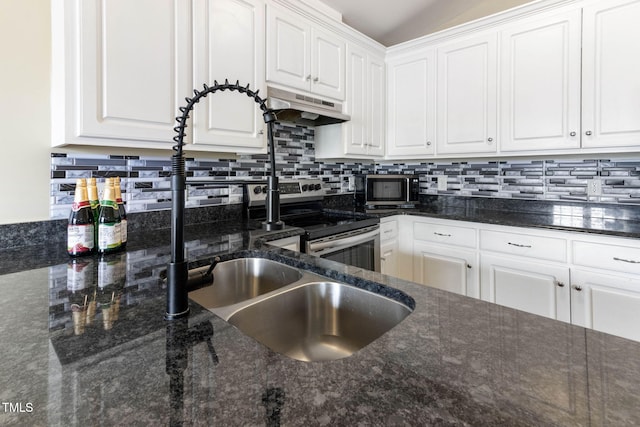 kitchen featuring appliances with stainless steel finishes, decorative backsplash, white cabinetry, and under cabinet range hood