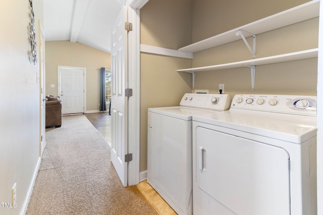 laundry room with baseboards, laundry area, separate washer and dryer, and light colored carpet