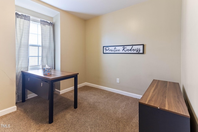 carpeted home office featuring baseboards