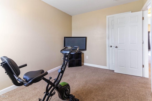 workout area with carpet and baseboards