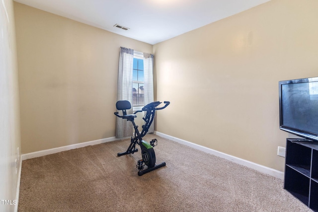 exercise room with carpet floors, visible vents, and baseboards