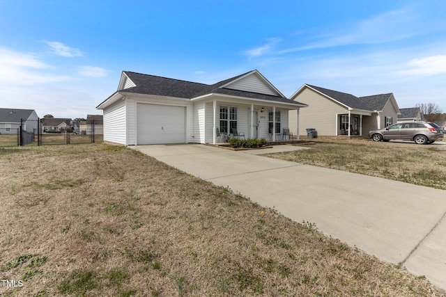 single story home with a porch, fence, a garage, driveway, and a front lawn