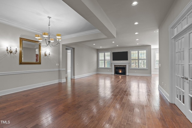 unfurnished living room featuring recessed lighting, baseboards, a high end fireplace, and hardwood / wood-style flooring