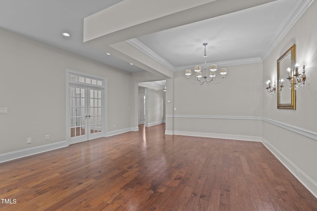 spare room with ornamental molding, french doors, baseboards, and wood finished floors